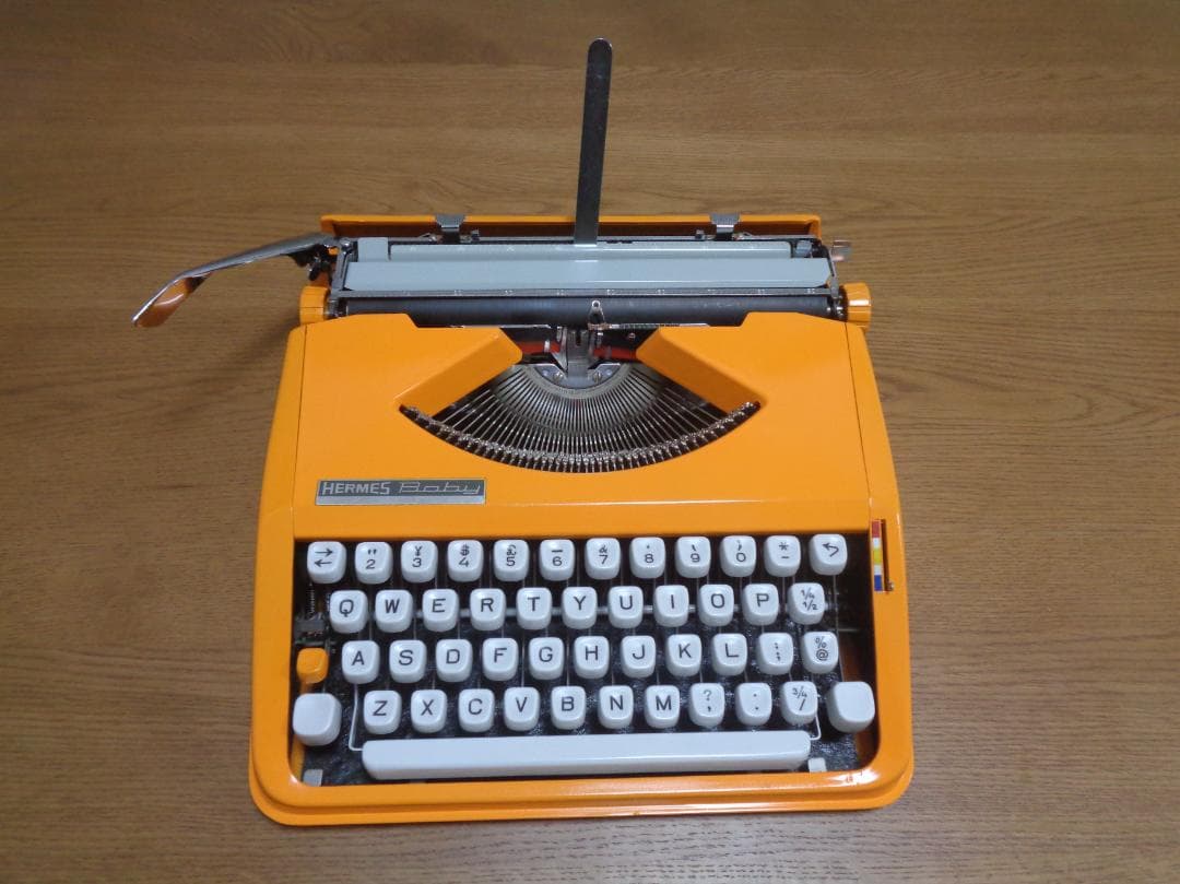 完働品HERMES Baby エルメスベイビータイプライターオレンジカラー