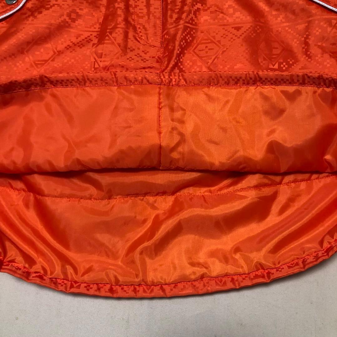 セットアップ マンシングウェア 中綿 パーカー スカート オレンジ 総柄