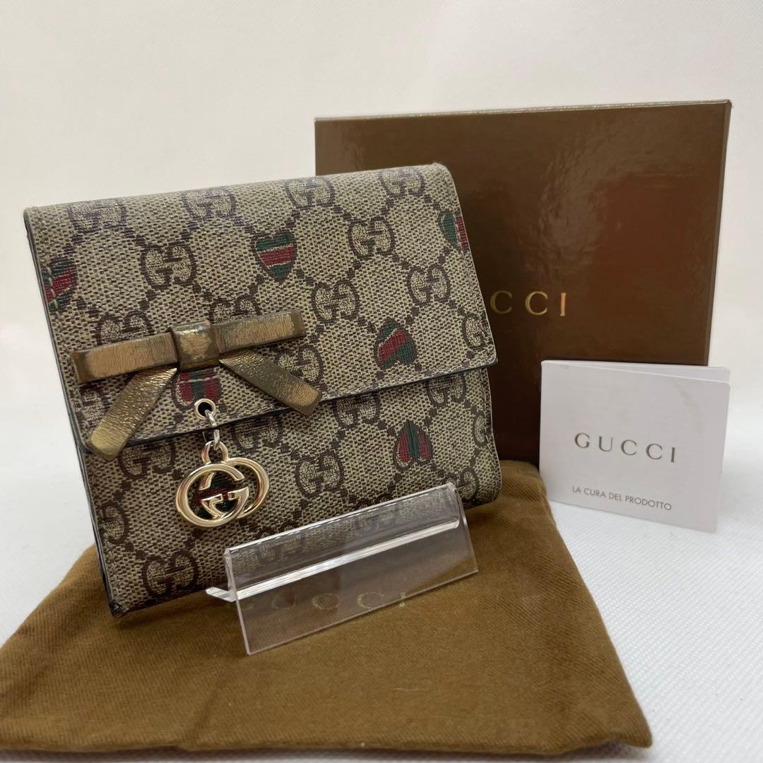 【美品/付属品完備】グッチ 二つ折り財布 小銭 GGシマ リボン ロゴチャーム 楽天市場】【新品未使用品】【財布】GUCCI グッチ GG ボウ レザー